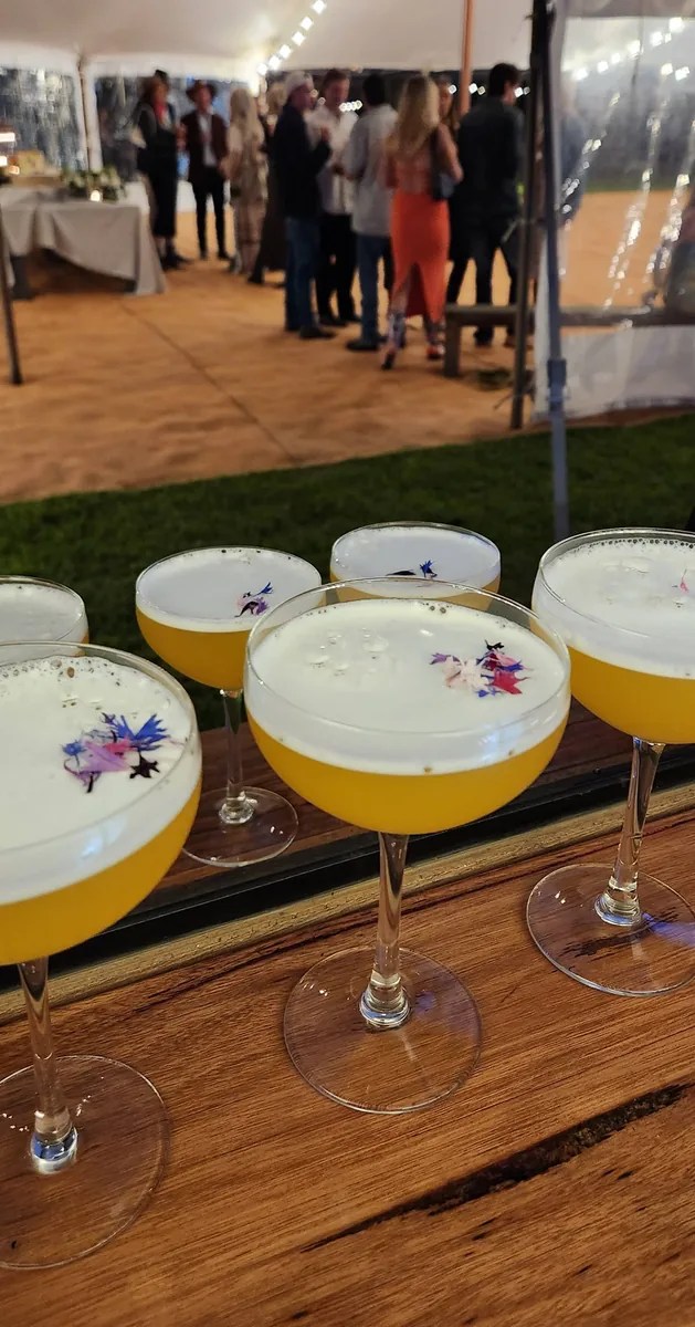 Silverwood Station signature cocktails garnished with edible flowers at a marquee event